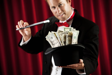 Magician: Doing a Trick with Hat Full of Money