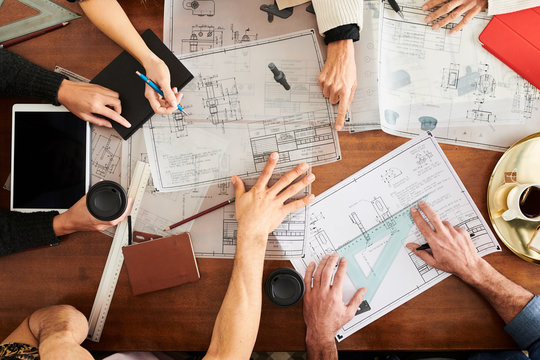 Group of architects at working process.