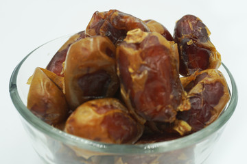 Kurma or dates fruits isolated on white background
