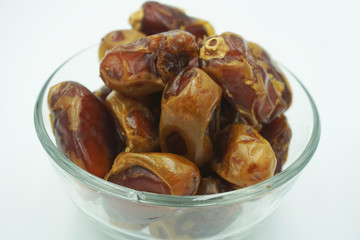 Kurma or dates fruits isolated on white background