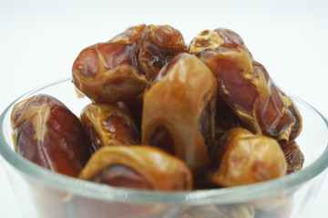 Kurma or dates fruits isolated on white background