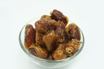 Kurma or dates fruits isolated on white background