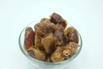 Kurma or dates fruits isolated on white background