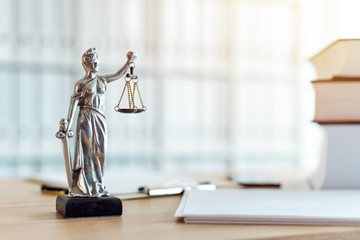 Lady Justice statue in law firm office - obrazy, fototapety, plakaty