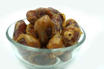 Kurma or dates fruits isolated on white background