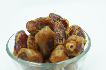 Kurma or dates fruits isolated on white background