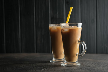 Ice coffee on a dark background with copy space.