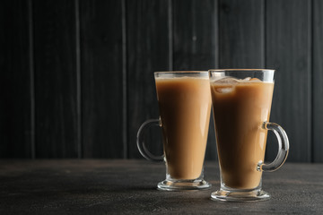 Ice coffee on a dark background with copy space.