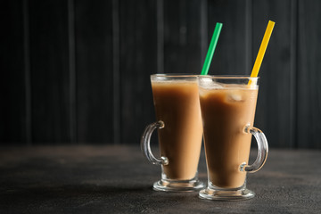 Ice coffee on a dark background with copy space.