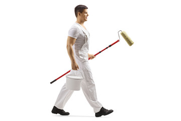 Painter walking with a roller and a bucket © Ljupco Smokovski