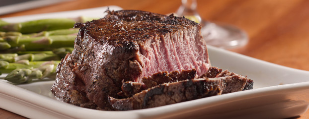 tenderloin steak cut open cooked rare in panoramic composition