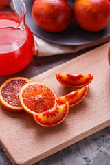 blood orange and juice on a dark background