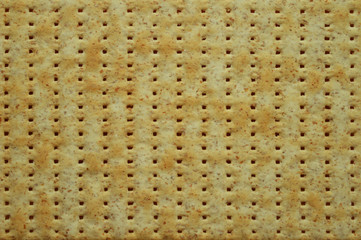 Top view of jewish flatbread matzo like a background. Trendy texture. Food concept.