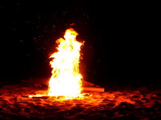 bonfire on the beach at night
