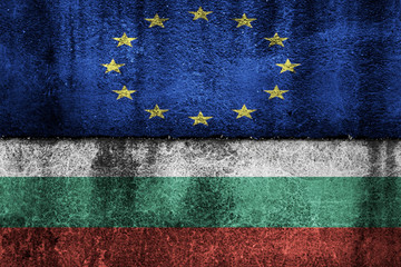 two flags on a cracked wall, the European Union and Bulgaria