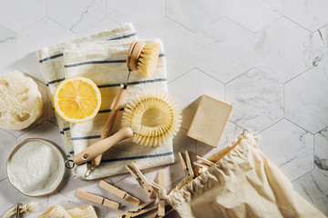 Eco friendly natural cleaning tools and products, bamboo dish brushes and lemon with baking soda. Zero waste concept. Plastic free.