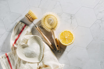 Natural cleaning products lemon and baking soda with bamboo dish brushs. Eco friendly. Zero waste concept. Plastic free.
