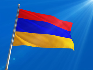 Fototapeta na wymiar Armenia National Flag Waving on pole against deep blue sky background. High Definition
