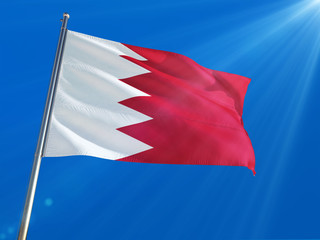 Bahrain National Flag Waving on pole against deep blue sky background. High Definition