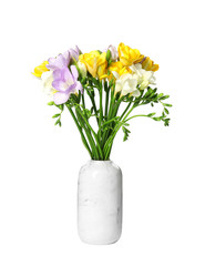 Bouquet of fresh freesia flowers in vase isolated on white