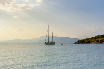 Fototapeta na wymiar The yacht sails moored on the open sea
