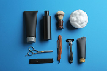 Flat lay composition with men's cosmetic products on color background. Space for design