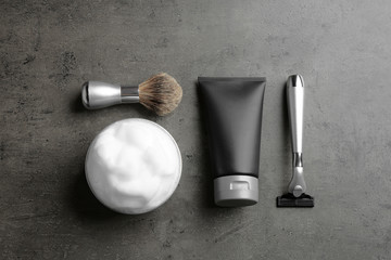 Flat lay composition with men's cosmetic products on grey background. Space for design