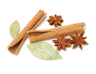 Cinnamon and anise on white background 