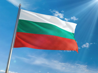 Bulgaria National Flag Waving on pole against sunny blue sky background. High Definition