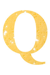 The letter "Q" of cheese with holes on a white isolated background, the symbol of proper nutrition and the alphabet.