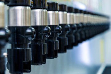 many modern faucets for pouring beer in a row. Horizontal frame