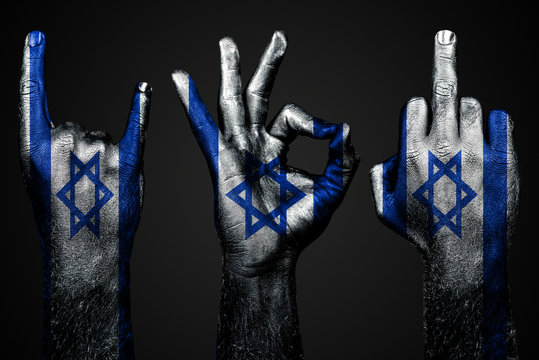 a set of three hands with a painted flag Israel show middle finger, goat and Okay, a sign of aggression, protest and approval on a dark background.