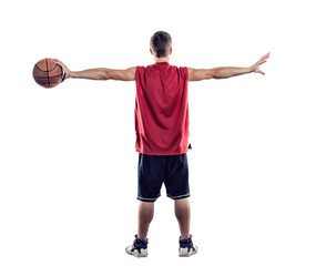 Basketball player standing back to camera with ball in hand isolated on white background