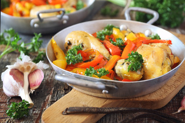 Stew chicken with bell peppers, parsley and garlic