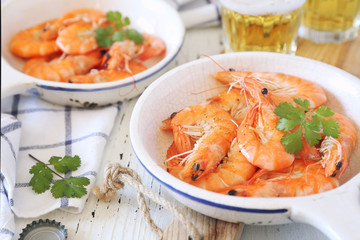 Two portions of fried shrimps and beer