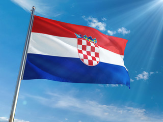 Croatia National Flag Waving on pole against sunny blue sky background. High Definition