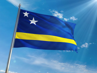 Curacao National Flag Waving on pole against sunny blue sky background. High Definition