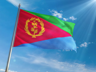 Eritrea National Flag Waving on pole against sunny blue sky background. High Definition