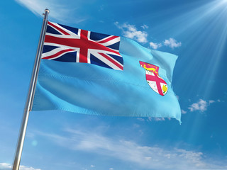 Fiji National Flag Waving on pole against sunny blue sky background. High Definition
