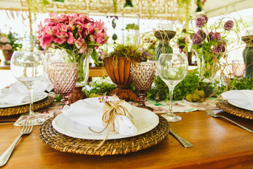 Wedding Setup. Banquet with table and chairs. Decoration, flowers, ware, glass