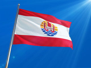 Naklejka na ściany i meble French Polynesia National Flag Waving on pole against deep blue sky background. High Definition