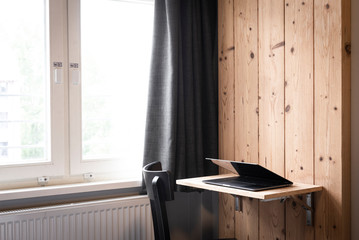 Laptop computer on wooden desk