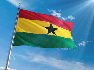 Ghana National Flag Waving on pole against sunny blue sky background. High Definition