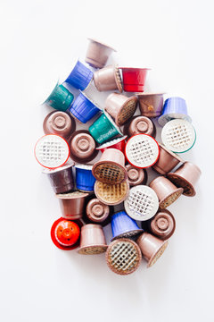 Empty Coffee capsules on clean  background, top view.