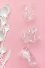 Plastic utensils, Forks, spoons, knives. Picnic dishes. not eco-friendly plastic. Environmental protection.