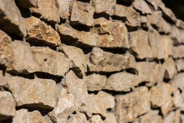 Old stone wall backgroung Angle shooted ancient wall