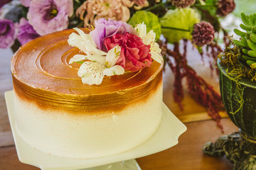 Fototapeta na wymiar Wedding Setup. Cake tables with sweet, decoration and flowers 