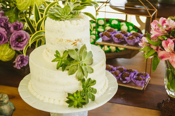 Wedding Setup. Cake tables with sweet, decoration and flowers 