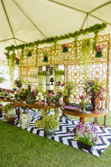 Wedding Setup. Cake tables with sweet, decoration and flowers 