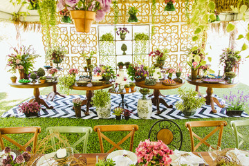 Wedding Setup. Cake tables with sweet, decoration and flowers 